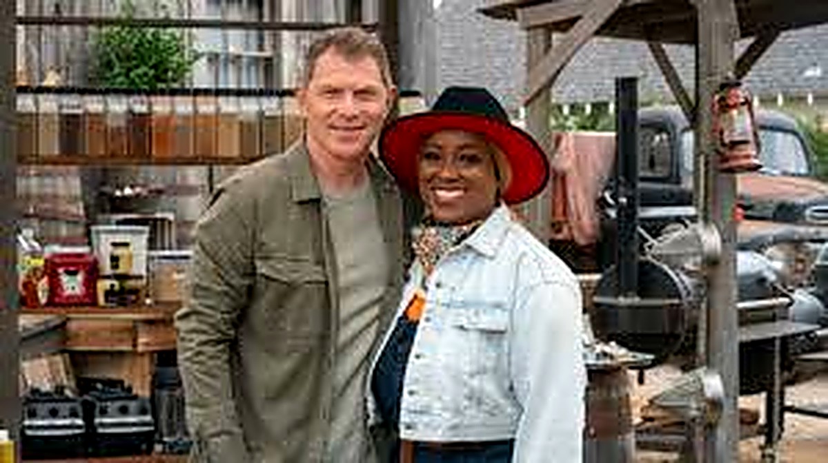 Pitmaster Erica Barrett beside Bobby Flay on the set of Food Network's BBQ Brawl